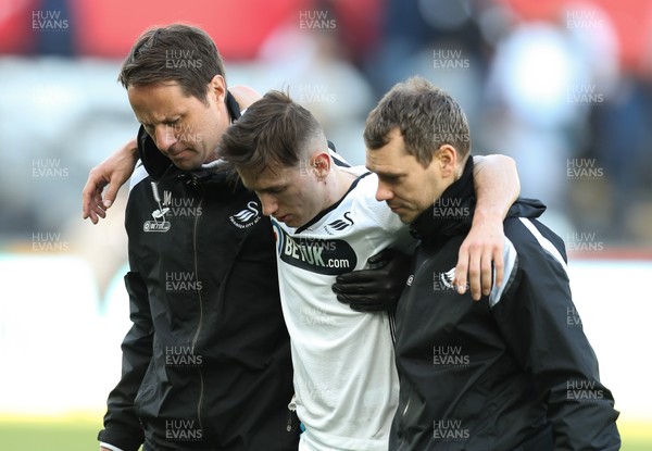 060419 - Swansea City v Middlesbrough, Premier League - Bersant Celina of Swansea City is helped from the pitch at the end of the match
