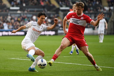 060426 - Swansea City v Middlesbrough - Sky Bet Championship - Eom Ji-Sung of Swansea City is challenged by Tommy Conway of Middlesbrough