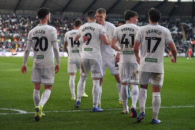 060426 - Swansea City v Middlesbrough - Sky Bet Championship - Zan Vipotnik of Swansea City celebrates scoring his second goal from the penalty spot with team mates
