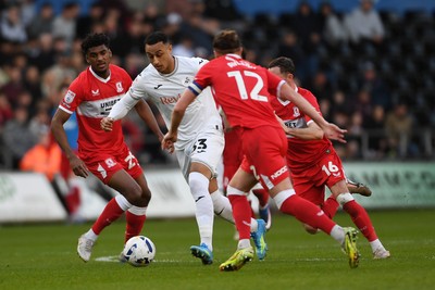 060426 - Swansea City v Middlesbrough - Sky Bet Championship - Adam Idah of Swansea City is challenged by Luke Ayling of Middlesbrough