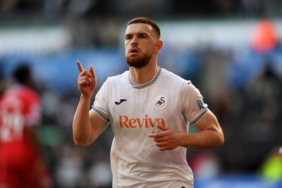 060426 - Swansea City v Middlesbrough - Sky Bet Championship - Zan Vipotnik of Swansea City scores from the penalty spot to equalise the game