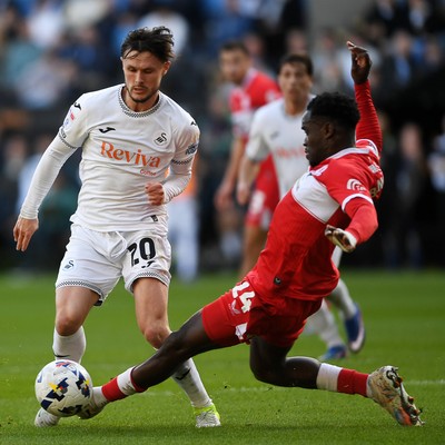 060426 - Swansea City v Middlesbrough - Sky Bet Championship - Liam Cullen of Swansea City is taken out by Alex Bangura of Middlesbrough to earn his side a penalty