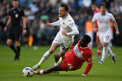 060426 - Swansea City v Middlesbrough - Sky Bet Championship - Liam Cullen of Swansea City is taken out by Alex Bangura of Middlesbrough to earn his side a penalty