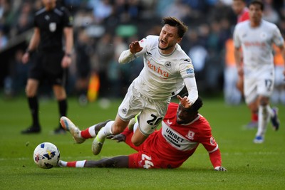 060426 - Swansea City v Middlesbrough - Sky Bet Championship - Liam Cullen of Swansea City is taken out by Alex Bangura of Middlesbrough to earn his side a penalty