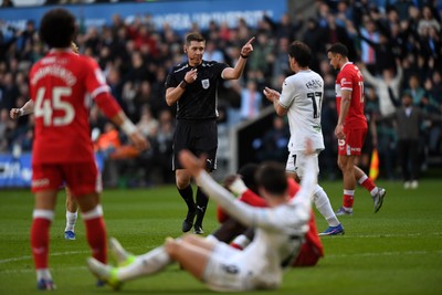 060426 - Swansea City v Middlesbrough - Sky Bet Championship - Liam Cullen of Swansea City is taken out by Alex Bangura of Middlesbrough to earn his side a penalty