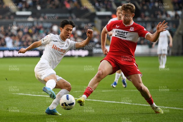 060426 - Swansea City v Middlesbrough - Sky Bet Championship - Eom Ji-Sung of Swansea City is challenged by Tommy Conway of Middlesbrough