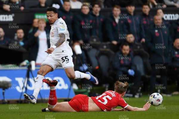 060426 - Swansea City v Middlesbrough - Sky Bet Championship - Ronald of Swansea City is challenged by  Finley Munroe of Middlesbrough