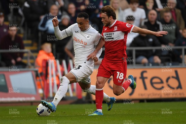 060426 - Swansea City v Middlesbrough - Sky Bet Championship - Adam Idah of Swansea City is challenged by Aidan Morris of Middlesbrough