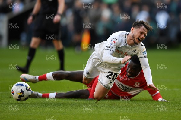 060426 - Swansea City v Middlesbrough - Sky Bet Championship - Liam Cullen of Swansea City is taken out by Alex Bangura of Middlesbrough to earn his side a penalty