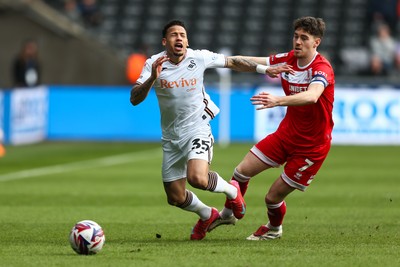 080325 - Swansea City v Middlesbrough - Sky Bet Championship - Hayden Hackney of Middlesborough brings down Ronald Pereira Martin of Swansea City