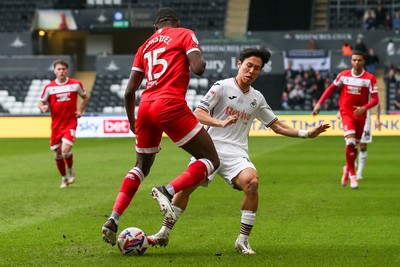 080325 - Swansea City v Middlesbrough - Sky Bet Championship - Ji-Sung Eom of Swansea City and Anfernee Dijksteel of Middlesborough compete for the ball