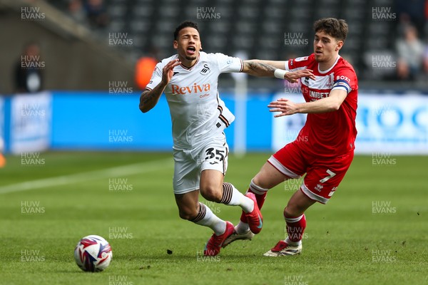 080325 - Swansea City v Middlesbrough - Sky Bet Championship - Hayden Hackney of Middlesborough brings down Ronald Pereira Martin of Swansea City