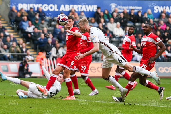 080325 - Swansea City v Middlesbrough - Sky Bet Championship - Harry Darling of Swansea City heads the ball towards goal