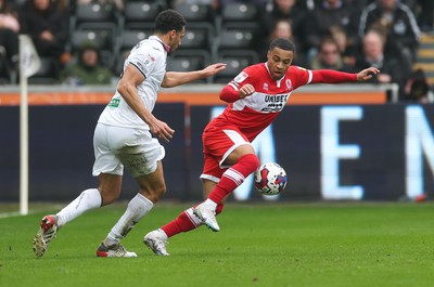 110323 - Swansea City v Middlesbrough, EFL Sky Bet Championship - Ben Cabango of Swansea City and Cameron Archer of Middlesbrough compete for the ball