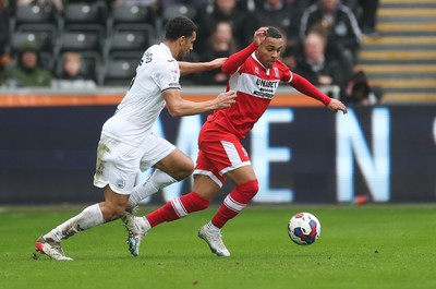 110323 - Swansea City v Middlesbrough, EFL Sky Bet Championship - Ben Cabango of Swansea City and Cameron Archer of Middlesbrough compete for the ball