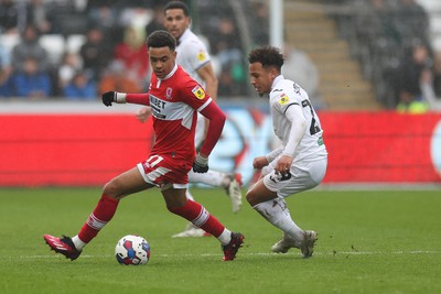 110323 - Swansea City v Middlesbrough, EFL Sky Bet Championship - Aaron Ramsey of Middlesbrough and Matty Sorinola of Swansea City compete for the ball