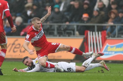 110323 - Swansea City v Middlesbrough, EFL Sky Bet Championship - Riley McGree of Middlesbrough is brought down by Matt Grimes of Swansea City