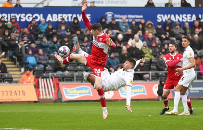 110323 - Swansea City v Middlesbrough, EFL Sky Bet Championship - Joel Piroe of Swansea City tries a spectacular shot at goal as Darragh Lenihan of Middlesbrough challenges