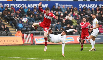 110323 - Swansea City v Middlesbrough, EFL Sky Bet Championship - Joel Piroe of Swansea City tries a spectacular shot at goal as Darragh Lenihan of Middlesbrough challenges