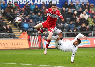 110323 - Swansea City v Middlesbrough, EFL Sky Bet Championship - Joel Piroe of Swansea City tries a spectacular shot at goal as Darragh Lenihan of Middlesbrough challenges