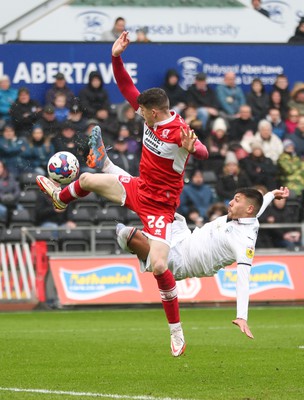 110323 - Swansea City v Middlesbrough, EFL Sky Bet Championship - Joel Piroe of Swansea City tries a spectacular shot at goal as Darragh Lenihan of Middlesbrough challenges