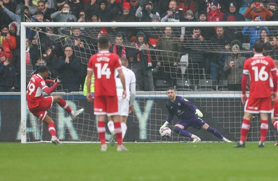 110323 - Swansea City v Middlesbrough, EFL Sky Bet Championship - Chuba Akpom of Middlesbrough scores the third goal as he puts a penalty past Swansea City goalkeeper Andy Fisher