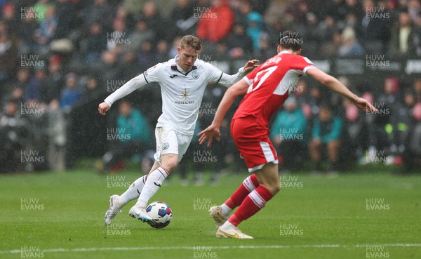 110323 - Swansea City v Middlesbrough, EFL Sky Bet Championship - Ollie Cooper of Swansea City takes on Paddy McNair of Middlesbrough