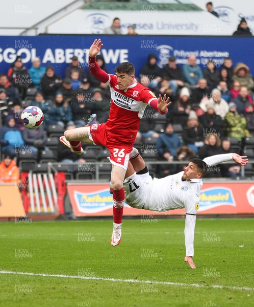 110323 - Swansea City v Middlesbrough, EFL Sky Bet Championship - Joel Piroe of Swansea City tries a spectacular shot at goal as Darragh Lenihan of Middlesbrough challenges