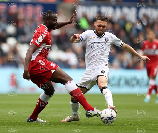 230422 - Swansea City v Middlesbrough - SkyBet Championship - Souleymane Bamba of Middlesbrough is challenged by Matt Grimes of Swansea City