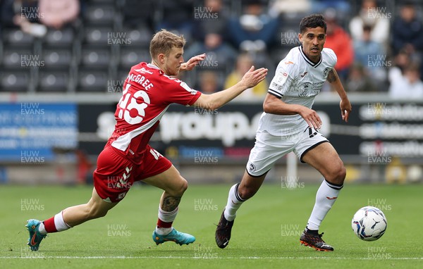 230422 - Swansea City v Middlesbrough - SkyBet Championship - Kyle Naughton of Swansea City is challenged by Riley McGree of Middlesbrough