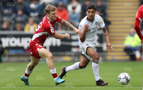 230422 - Swansea City v Middlesbrough - SkyBet Championship - Kyle Naughton of Swansea City is challenged by Riley McGree of Middlesbrough