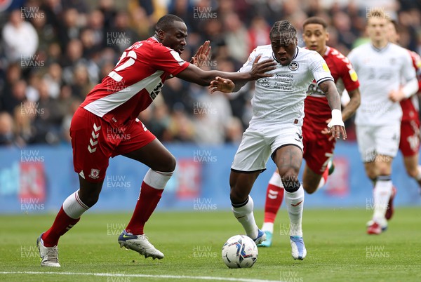 230422 - Swansea City v Middlesbrough - SkyBet Championship - Michael Obafemi of Swansea City is challenged by Souleymane Bamba of Middlesbrough