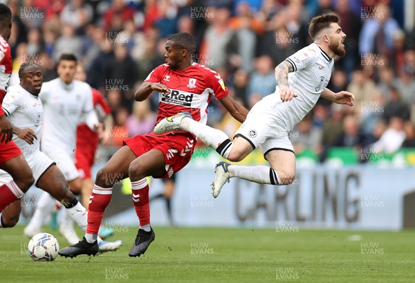 230422 - Swansea City v Middlesbrough - SkyBet Championship - Ryan Manning of Swansea City is tackled by Anfernee Dijksteel of Middlesbrough