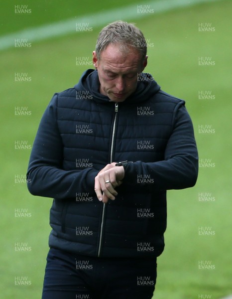 031020 - Swansea City v Millwall - SkyBet Championship - Swansea City Manager Steve Cooper looks at his watch