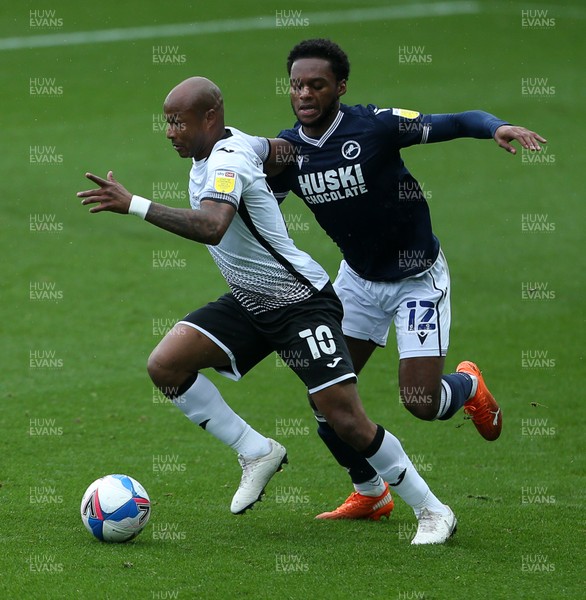 031020 - Swansea City v Millwall - SkyBet Championship - Andre Ayew of Swansea City is challenged by Mahlon Romeo of Millwall