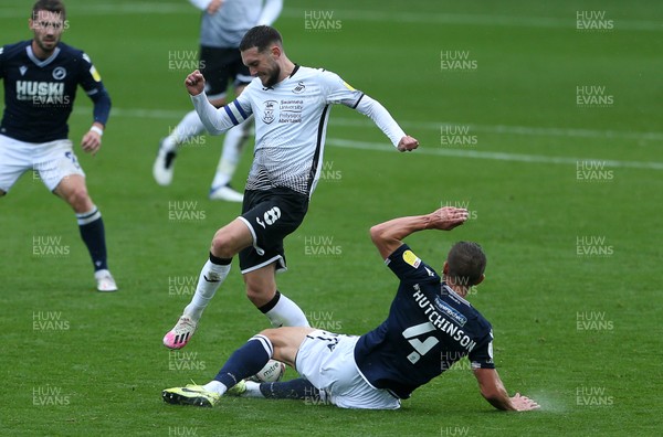 031020 - Swansea City v Millwall - SkyBet Championship - Matt Grimes of Swansea City is tackled by Shaun Hutchinson of Millwall