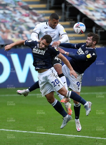 031020 - Swansea City v Millwall - SkyBet Championship - Ben Cabango of Swansea City is challenged by Mason Bennett and Tom Bradshaw of Millwall