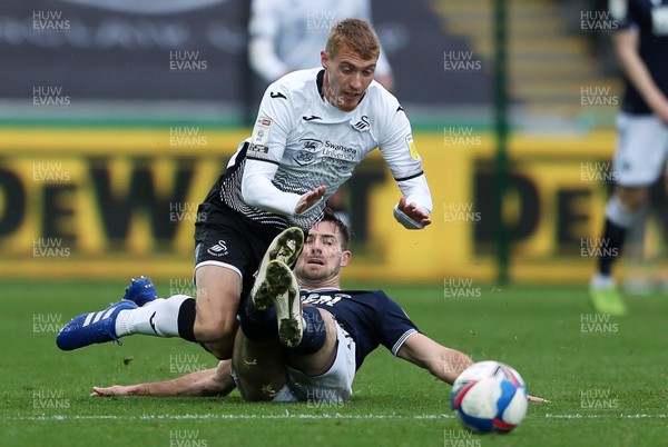 031020 - Swansea City v Millwall - SkyBet Championship - Jay Fulton of Swansea City is tackled by Ryan Leonard of Millwall