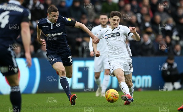 090219 - Swansea City v Millwall - SkyBet Championship - Daniel James of Swansea City gets the ball past Murray Wallace of Millwall