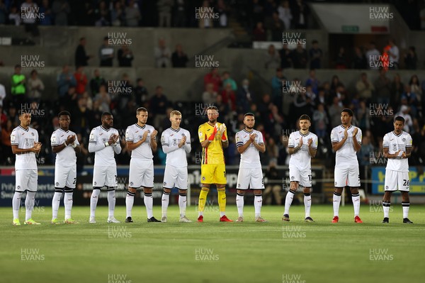150921 - Swansea City v Millwall - SkyBet Championship - Players respect a minutes applause on the 10th anniversary of the Gleision Colliery disaster