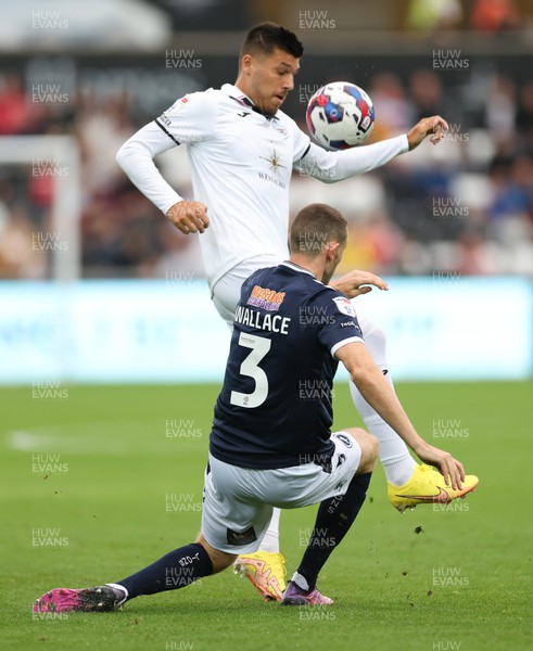 160822 - Swansea City v Millwall, Sky Bet Championship - Joel Piroe of Swansea City and Murray Wallace of Millwall compete for the ball