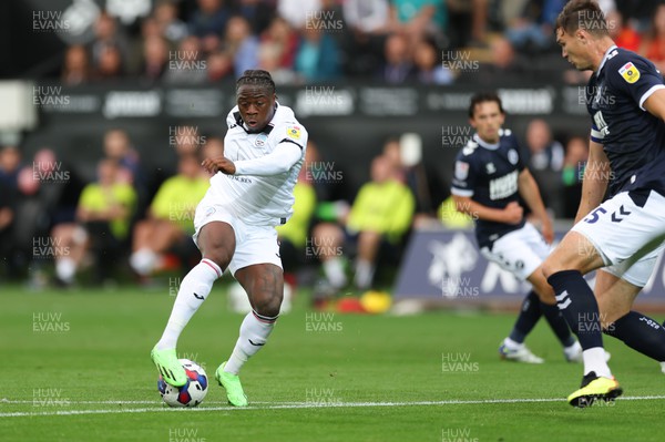 160822 - Swansea City v Millwall, Sky Bet Championship - Michael Obafemi of Swansea City lines up his shot as he scores the second goal