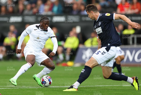 160822 - Swansea City v Millwall, Sky Bet Championship - Michael Obafemi of Swansea City lines up his shot as he scores the second goal