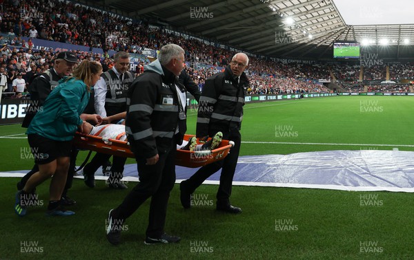 160822 - Swansea City v Millwall, Sky Bet Championship - Joel Latibeaudiere of Swansea City is stretchered off with an injury