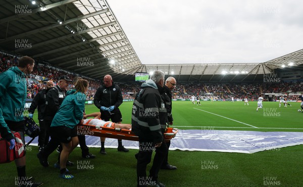 160822 - Swansea City v Millwall, Sky Bet Championship - Joel Latibeaudiere of Swansea City is stretchered off with an injury