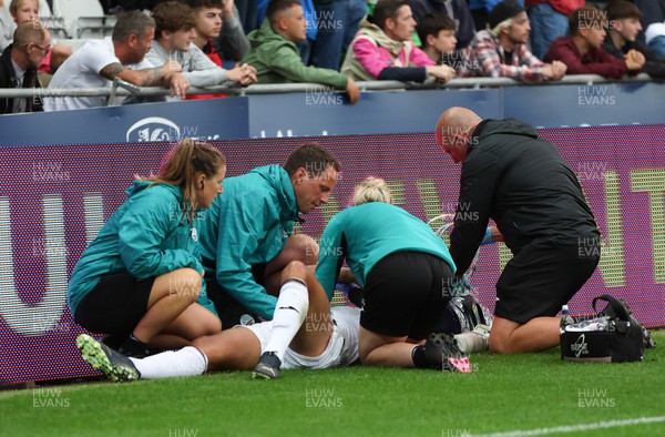 160822 - Swansea City v Millwall, Sky Bet Championship - Joel Latibeaudiere of Swansea City receives treatment before being stretchered off with an injury