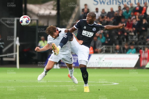160822 - Swansea City v Millwall, Sky Bet Championship - Joe Allen of Swansea City and Benik Afobe of Millwall compete for the ball