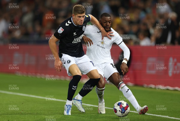 160822 - Swansea City v Millwall, Sky Bet Championship - Charlie Cresswell of Millwall holds off Olivier Ntcham of Swansea City