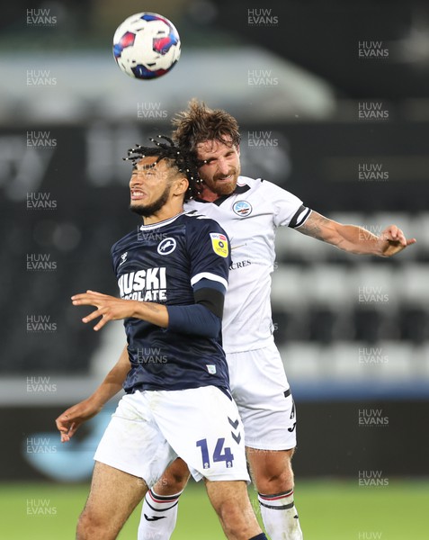 160822 - Swansea City v Millwall, Sky Bet Championship - Joe Allen of Swansea City and Tyler Burey of Millwall compete for the ball