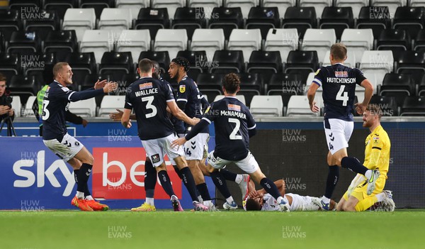 160822 - Swansea City v Millwall, Sky Bet Championship - Tyler Burey of Millwall celebrates with team mates after he scores a late goal to level the score at 2-2